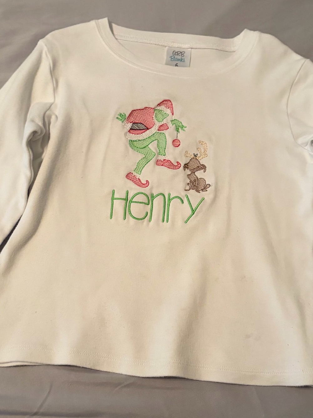 White Long-Sleeve Kids Top with Green & Red Embroidery - Grinch & dog